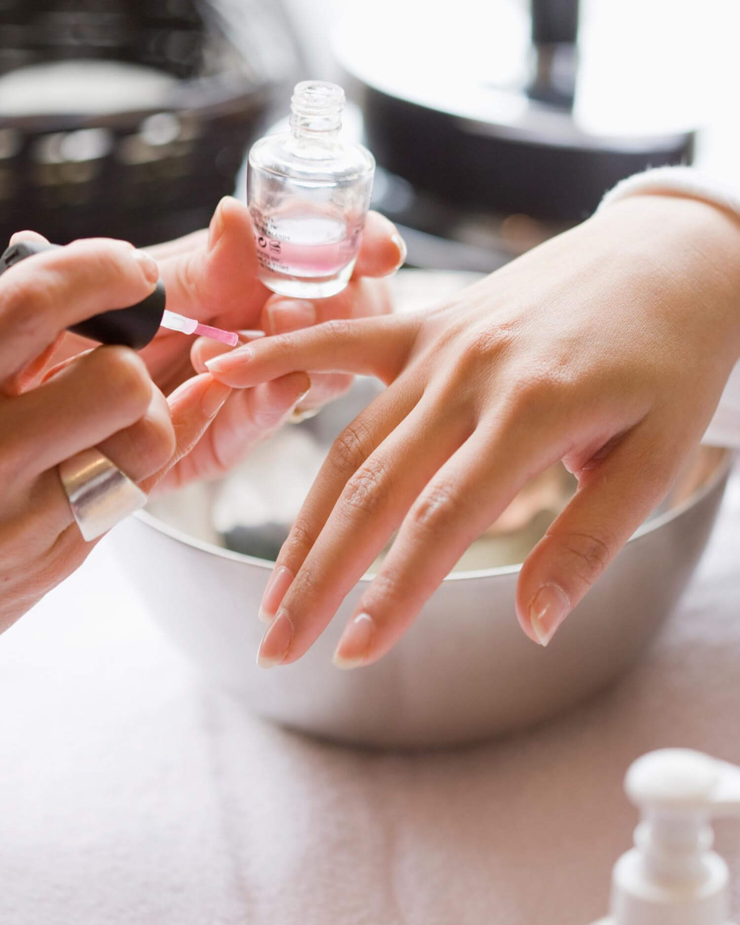 Woman having her nails painted during a manicure.