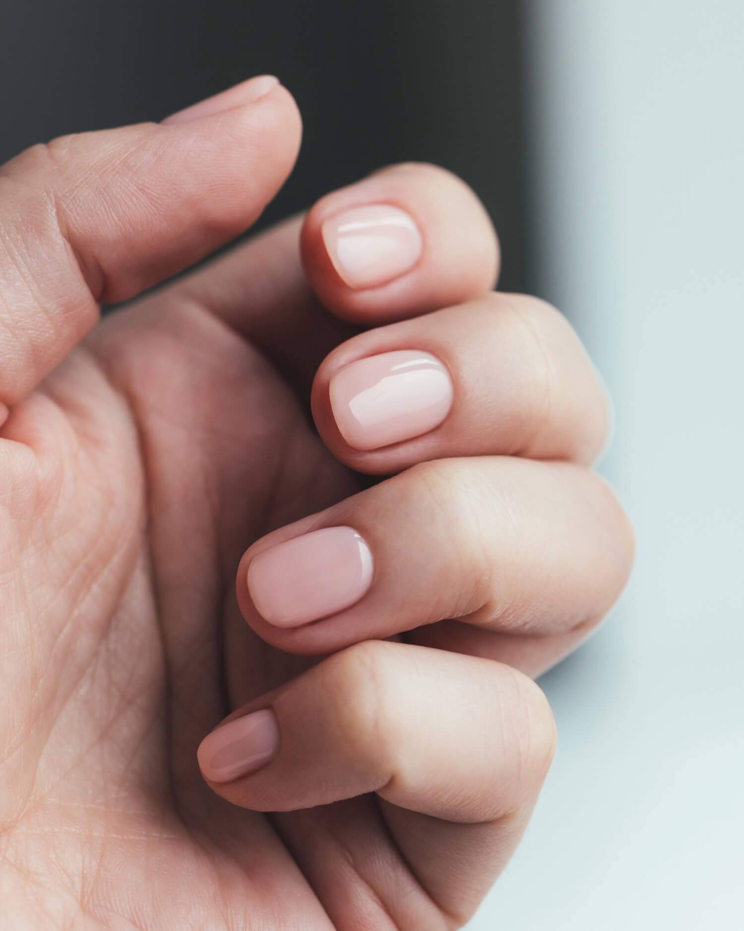 Woman receiving a manicure.