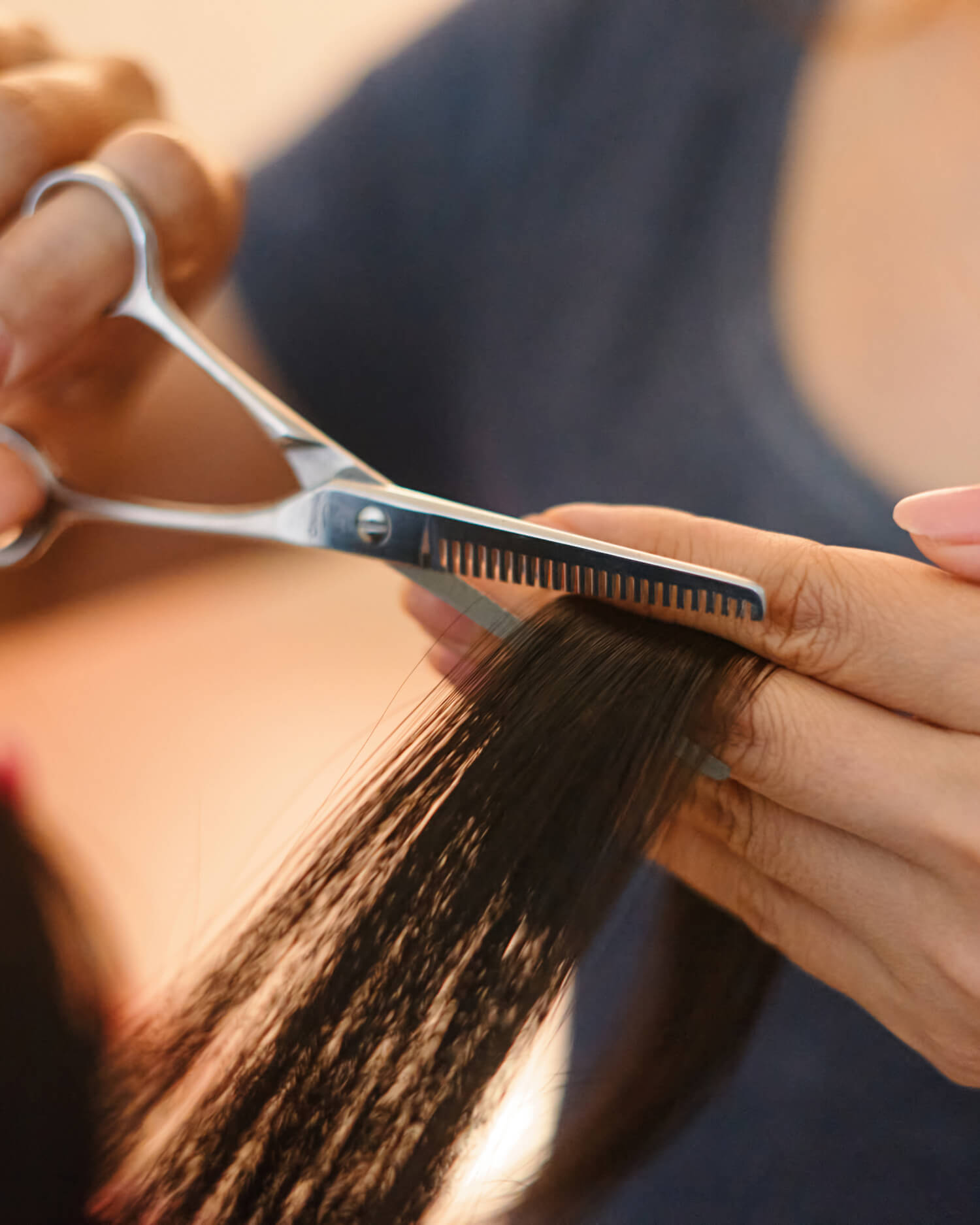 Woman getting her hair cut by a stylist