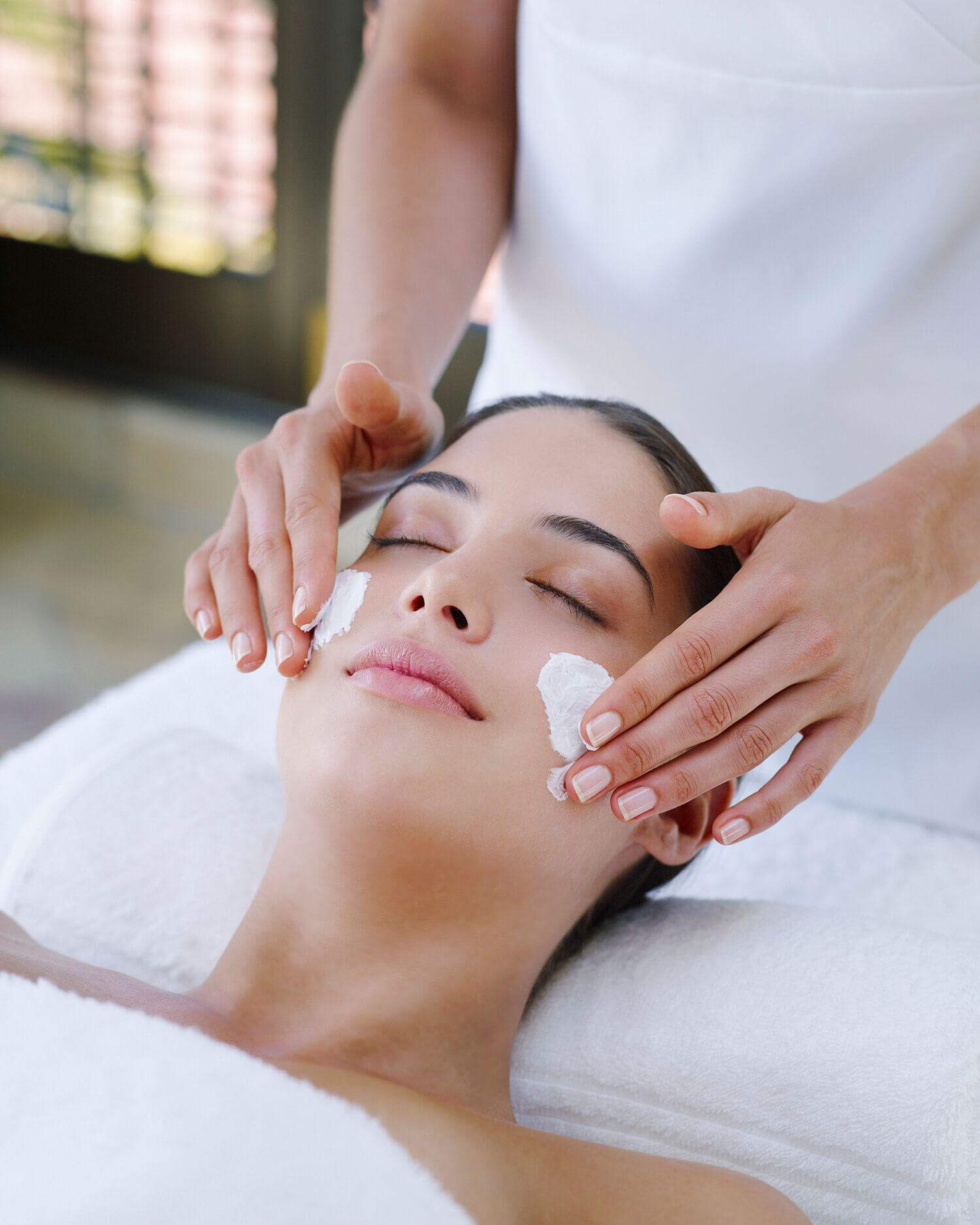 a woman getting a facial