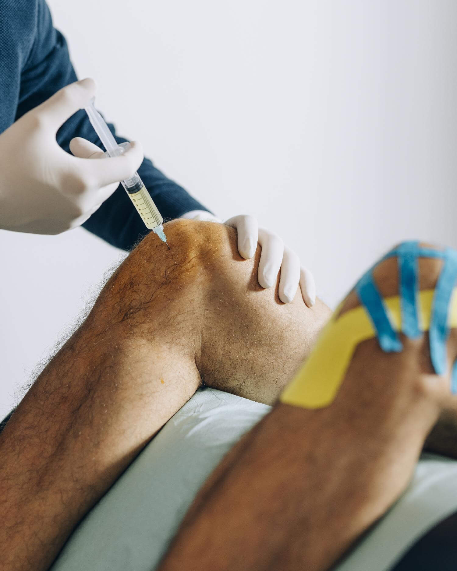 Client getting an injection around the knee